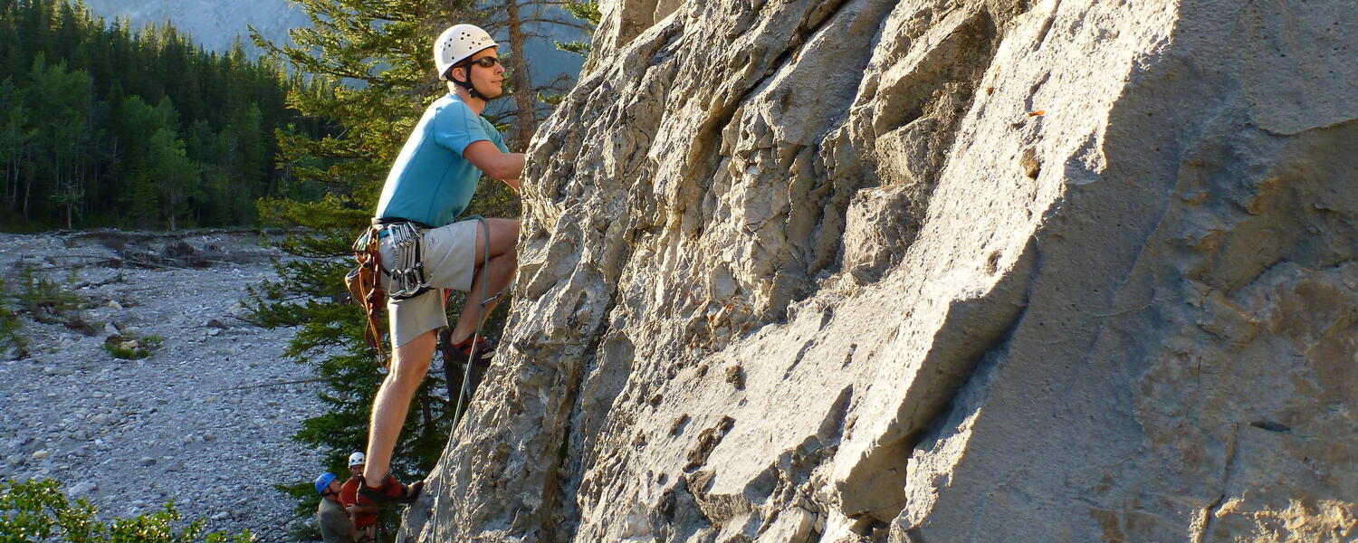 climber on rock wall