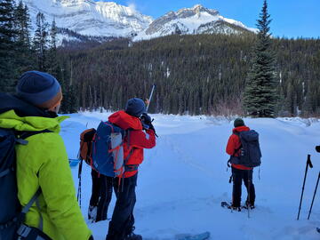 instructor pointing out avalanche terrain